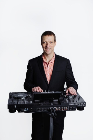 Chase March Chase March smiling behind a DJ controller